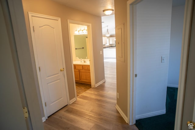 1409 S 30 E, Payson, UT 84651 - hall with baseboards, a sink, and light wood-style flooring