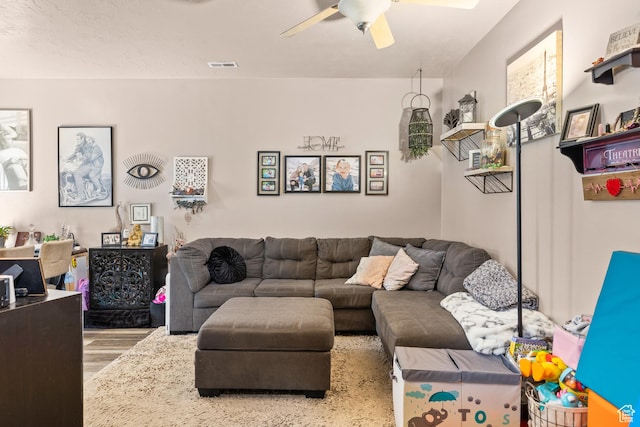 502 N 2480 W, Hurricane, UT 84737 - living room featuring a ceiling fan, visible vents, and wood finished floors