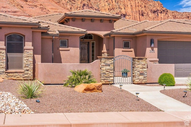 305 E 350 N, Ivins, UT 84738 - view of front of property with stucco siding, fence private yard, and stone siding