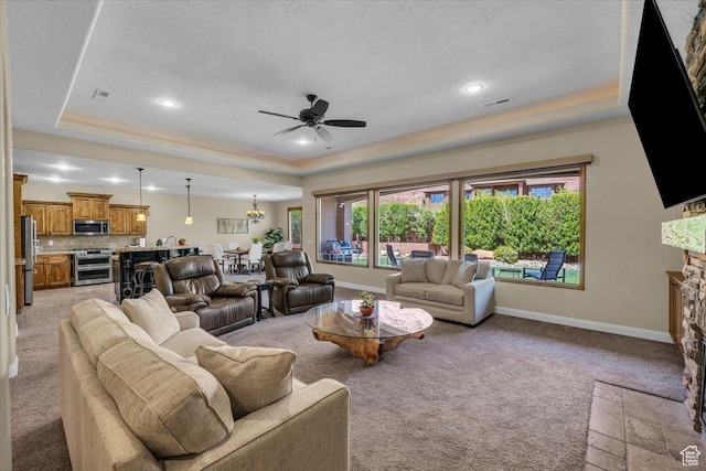305 E 350 N, Ivins, UT 84738 - living area featuring a ceiling fan, a tray ceiling, light colored carpet, and visible vents