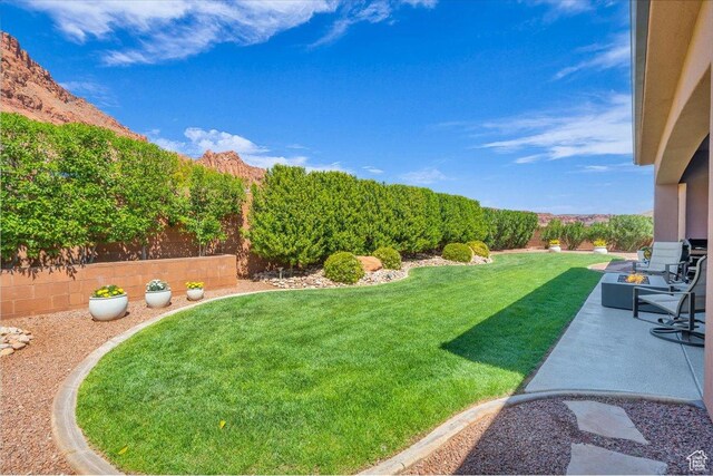 305 E 350 N, Ivins, UT 84738 - view of yard featuring a mountain view, a fenced backyard, and a patio area