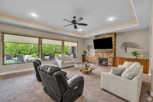 305 E 350 N, Ivins, UT 84738 - living area featuring a ceiling fan, visible vents, a fireplace, carpet floors, and a tray ceiling