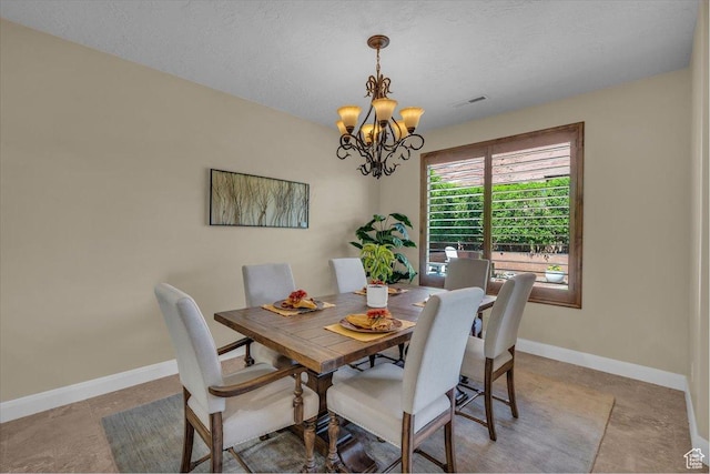 305 E 350 N, Ivins, UT 84738 - dining area with baseboards, visible vents, a textured ceiling, and a notable chandelier