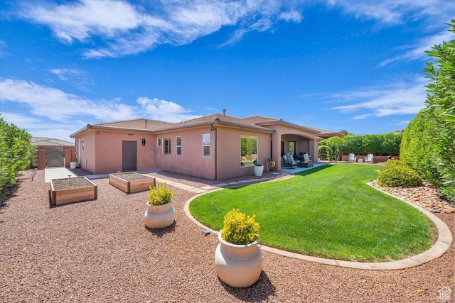305 E 350 N, Ivins, UT 84738 - rear view of house featuring fence, stucco siding, a yard, and a patio area