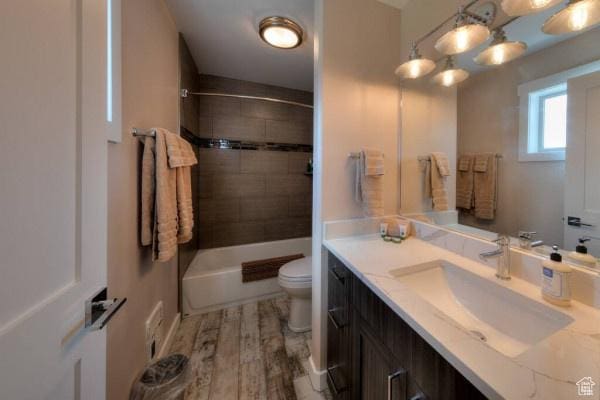 17 Tangren Cir, Moab, UT 84532 - full bath featuring toilet, bathtub / shower combination, wood finished floors, and vanity