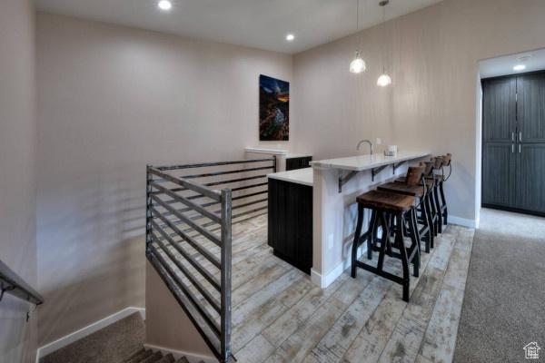 17 Tangren Cir, Moab, UT 84532 - bar with recessed lighting, baseboards, and pendant lighting