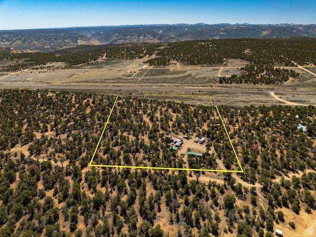 33383 W 8000 S, Duchesne, UT 84021 - aerial view of sparsely populated area with a mountain backdrop and property boundaries highlighted
