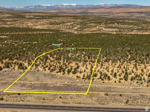 33383 W 8000 S, Duchesne, UT 84021 - overview of rural landscape featuring a mountain backdrop, property boundaries highlighted, and a desert landscape