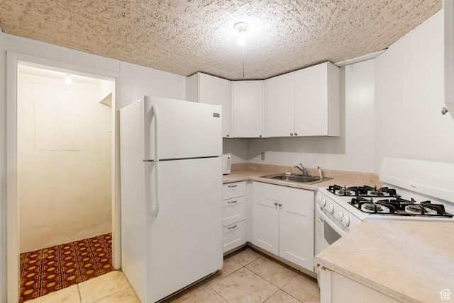 163 E 350 S, Logan, UT 84321 - kitchen with a sink, light countertops, white cabinets, and white appliances