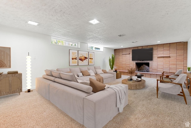 163 E 350 S, Logan, UT 84321 - carpeted living room featuring a textured ceiling and a brick fireplace