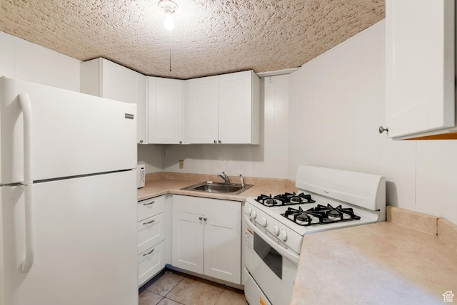 163 E 350 S, Logan, UT 84321 - kitchen featuring a sink, white cabinetry, white appliances, and light countertops