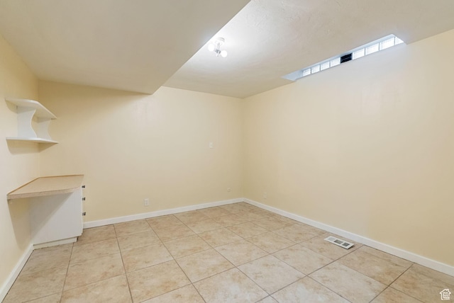 163 E 350 S, Logan, UT 84321 - empty room with light tile patterned flooring, baseboards, and visible vents