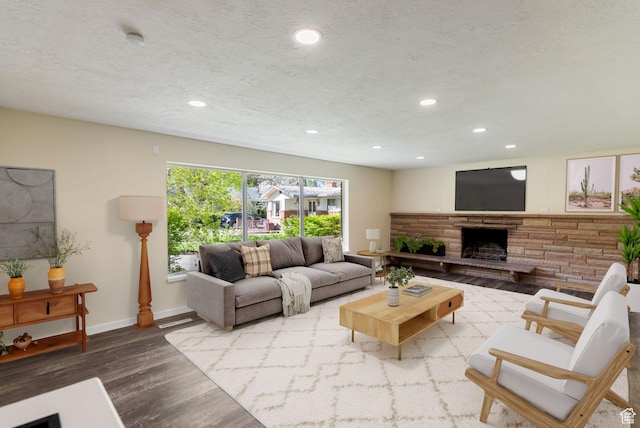 163 E 350 S, Logan, UT 84321 - living room with recessed lighting, baseboards, wood finished floors, and a fireplace