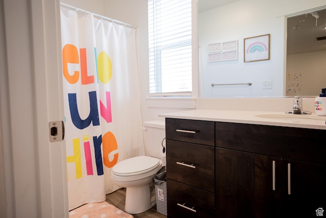 1809 S 1280 W, Logan, UT 84321 - full bathroom with a shower with curtain, visible vents, wood finished floors, vanity, and toilet
