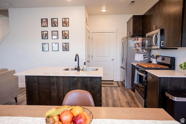 1809 S 1280 W, Logan, UT 84321 - kitchen featuring a sink, appliances with stainless steel finishes, dark brown cabinetry, and wood finished floors