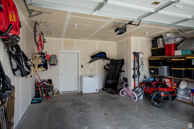 1809 S 1280 W, Logan, UT 84321 - garage featuring refrigerator and a garage door opener