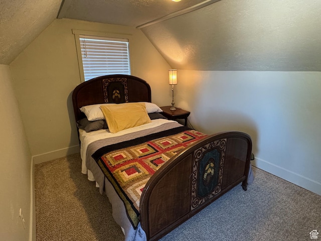 bedroom featuring carpet floors, a textured ceiling, and lofted ceiling