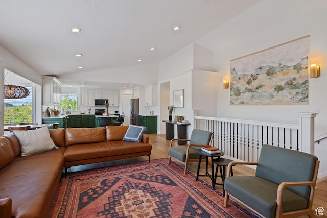 4356 W Elk Rim Rd, South Jordan, UT 84009 - living area with vaulted ceiling, light wood-style floors, and recessed lighting