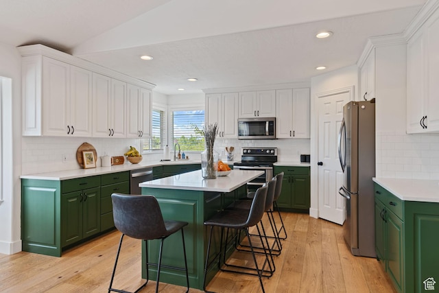 4356 W Elk Rim Rd, South Jordan, UT 84009 - kitchen featuring appliances with stainless steel finishes, green cabinetry, white cabinets, a sink, and recessed lighting