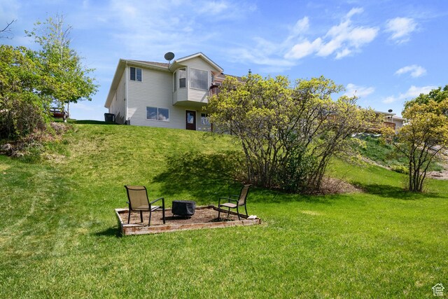 4356 W Elk Rim Rd, South Jordan, UT 84009 - view of green lawn featuring a fire pit