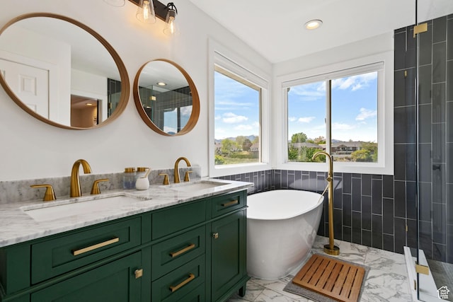 4356 W Elk Rim Rd, South Jordan, UT 84009 - bathroom featuring marble look tiles, a soaking tub, double vanity, a tile shower, and recessed lighting