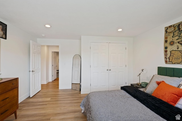 4356 W Elk Rim Rd, South Jordan, UT 84009 - bedroom featuring light wood-style flooring, a closet, recessed lighting, and baseboards