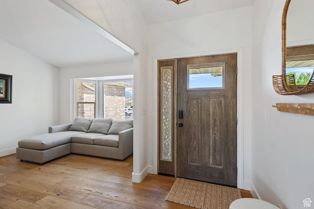 4356 W Elk Rim Rd, South Jordan, UT 84009 - foyer with vaulted ceiling, baseboards, and light wood-style flooring