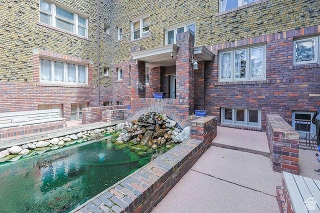 86 N B St Unit 11, Salt Lake City, UT 84103 - view of pool featuring a small pond