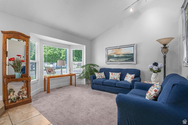 627 S 825 E, Layton, UT 84041 - living room featuring baseboards, rail lighting, light tile patterned floors, and vaulted ceiling