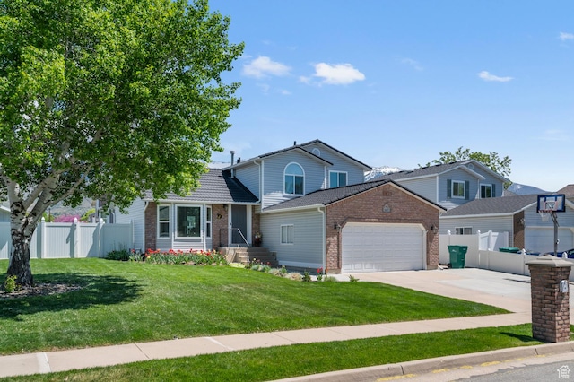627 S 825 E, Layton, UT 84041 - view of front of house with brick siding, an attached garage, fence, and driveway