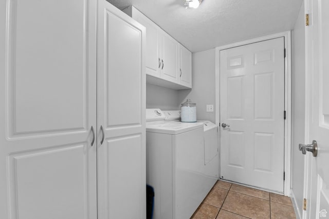 627 S 825 E, Layton, UT 84041 - laundry room featuring a textured ceiling, cabinet space, independent washer and dryer, and light tile patterned flooring