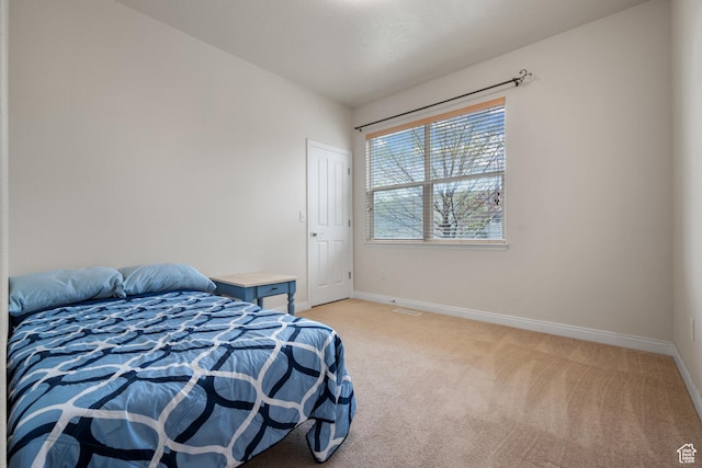 7673 N Red Oak E, Eagle Mountain, UT 84005 - bedroom featuring baseboards and light colored carpet