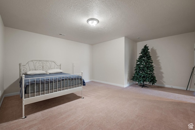 7673 N Red Oak E, Eagle Mountain, UT 84005 - carpeted bedroom with baseboards, a textured ceiling, and visible vents