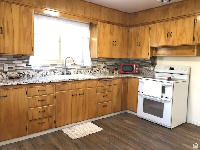 553 S 200 W, Brigham City, UT 84302 - kitchen featuring decorative backsplash, dark wood-style flooring, light stone countertops, range with two ovens, and a sink