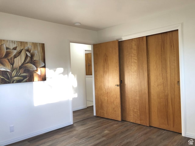 553 S 200 W, Brigham City, UT 84302 - unfurnished bedroom featuring a closet, baseboards, and wood finished floors