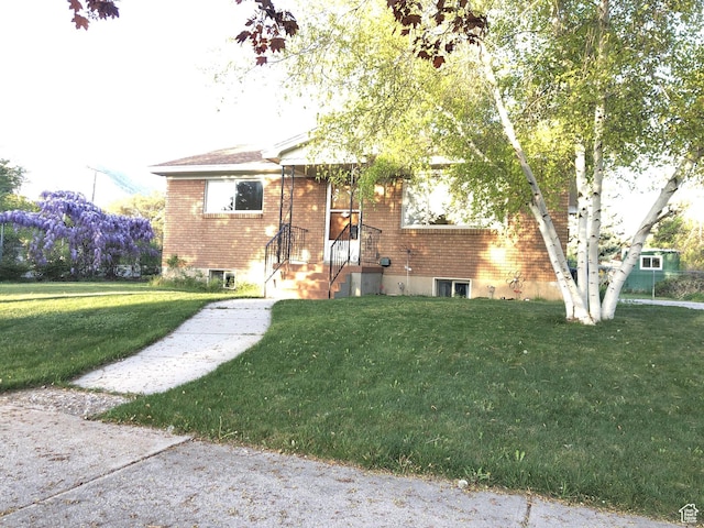 553 S 200 W, Brigham City, UT 84302 - view of front of house with brick siding and a front lawn