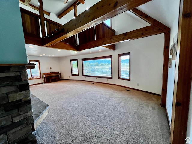 1752 Cedar View Rd, Soda Springs, ID 83276 - unfurnished living room with carpet, beamed ceiling, baseboards, recessed lighting, and high vaulted ceiling