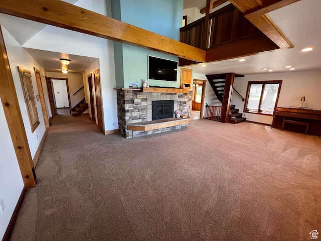 1752 Cedar View Rd, Soda Springs, ID 83276 - unfurnished living room with stairway, light colored carpet, baseboards, a fireplace, and recessed lighting