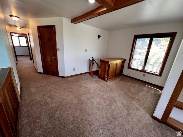 1752 Cedar View Rd, Soda Springs, ID 83276 - empty room with light carpet, beam ceiling, and baseboards