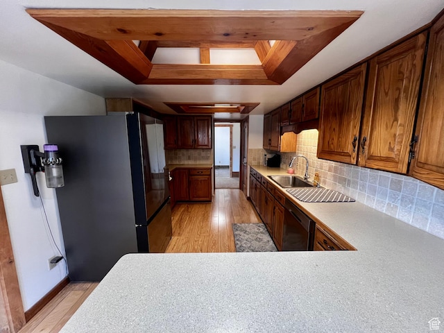 1752 Cedar View Rd, Soda Springs, ID 83276 - kitchen featuring freestanding refrigerator, a sink, a raised ceiling, dishwasher, and light wood finished floors
