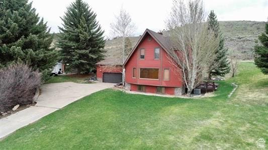 1752 Cedar View Rd, Soda Springs, ID 83276 - view of home's exterior with a garage, a yard, and driveway
