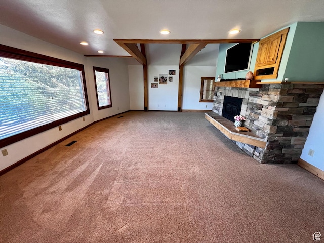 1752 Cedar View Rd, Soda Springs, ID 83276 - unfurnished living room featuring light colored carpet, baseboards, a stone fireplace, and recessed lighting