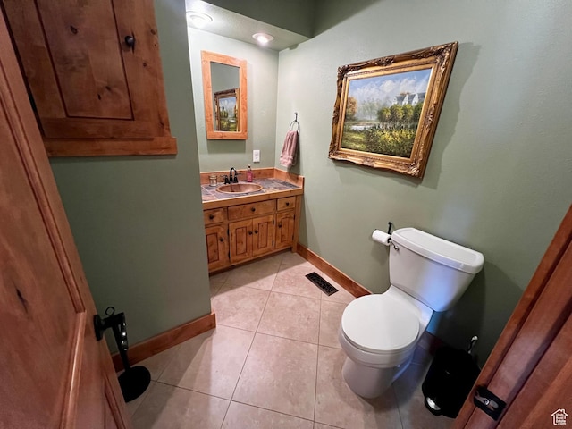 1752 Cedar View Rd, Soda Springs, ID 83276 - bathroom with toilet, vanity, baseboards, and tile patterned floors