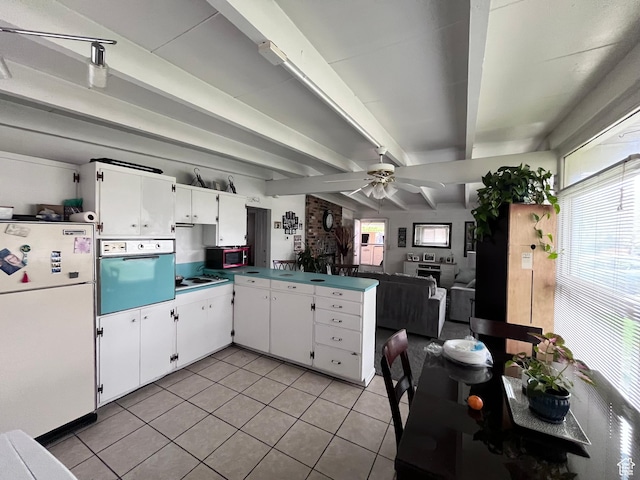 3766 S Orchard Ave E, South Ogden, UT 84403 - kitchen featuring freestanding refrigerator, wall oven, a peninsula, light tile patterned floors, and plenty of natural light