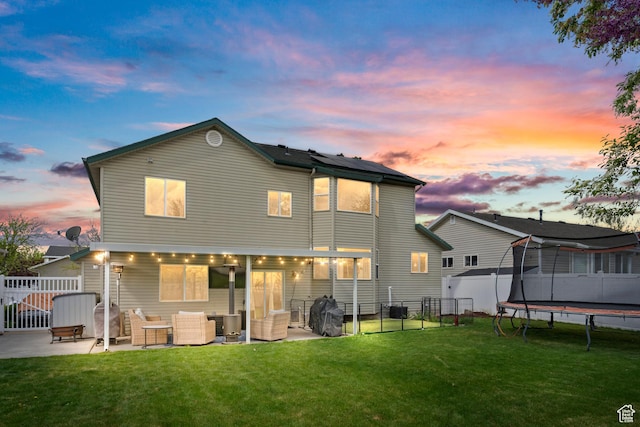 1415 S Bridgeview Dr W, Layton, UT 84041 - rear view of property with a lawn, outdoor lounge area, a gate, and a patio area