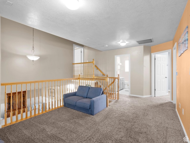 1415 S Bridgeview Dr W, Layton, UT 84041 - sitting room featuring baseboards, carpet, a textured ceiling, and an upstairs landing
