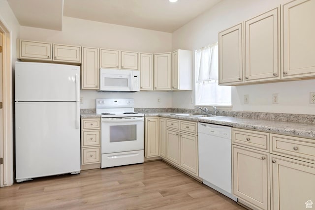 14499 S Siltstone Rd W, Herriman, UT 84096 - kitchen featuring white appliances, cream cabinetry, light countertops, and light wood-style flooring