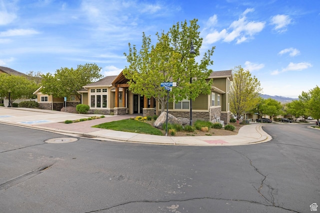 14499 S Siltstone Rd W, Herriman, UT 84096 - obstructed view of property with stone siding and a mountain view