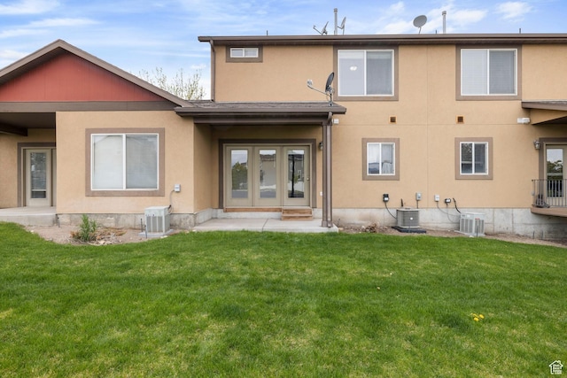 14499 S Siltstone Rd W, Herriman, UT 84096 - back of house featuring a yard and stucco siding