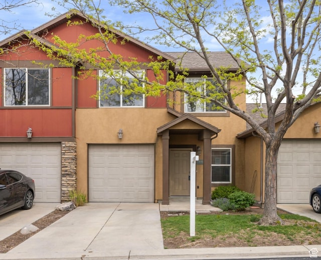 14499 S Siltstone Rd W, Herriman, UT 84096 - multi unit property with stone siding, stucco siding, an attached garage, and concrete driveway
